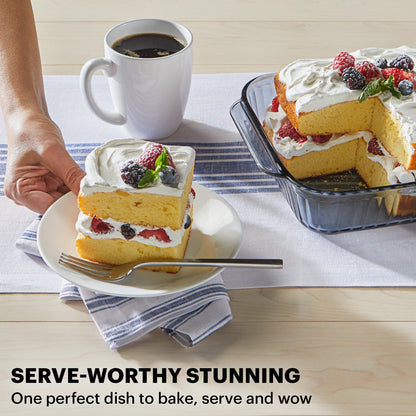 Pyrex bakeware with colorful cake and coffee on a wooden table with text